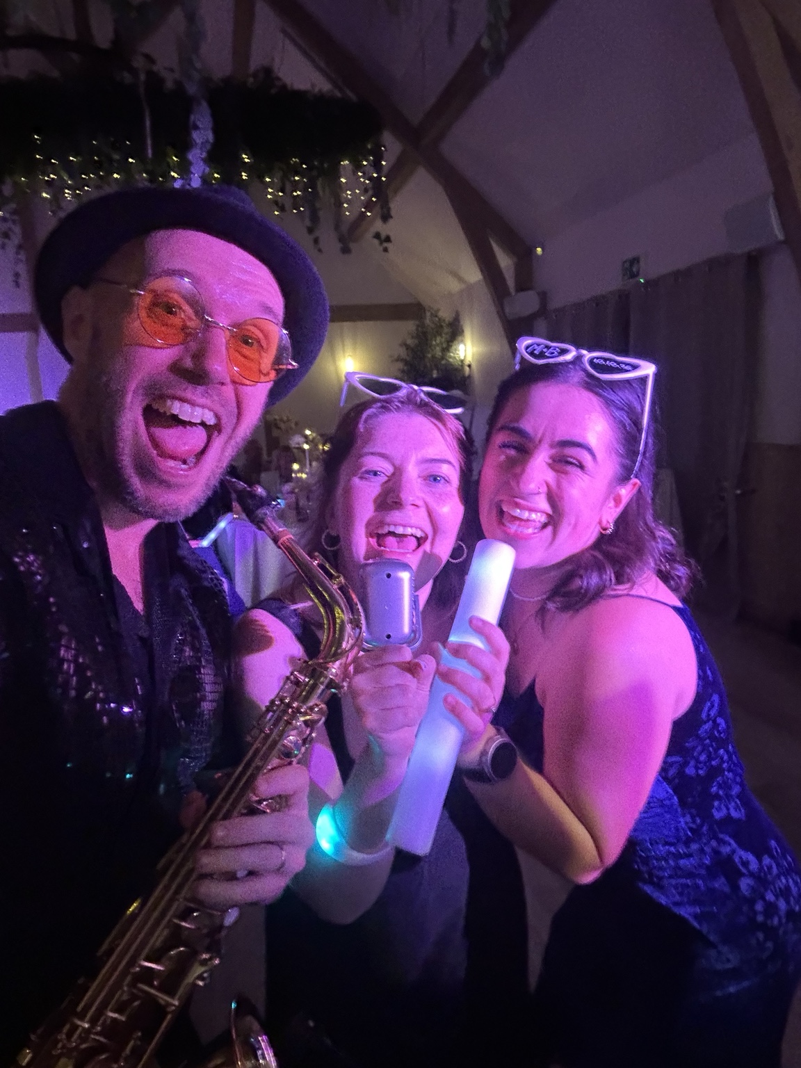 Spencer with wedding guests during the evening party at The River Barn