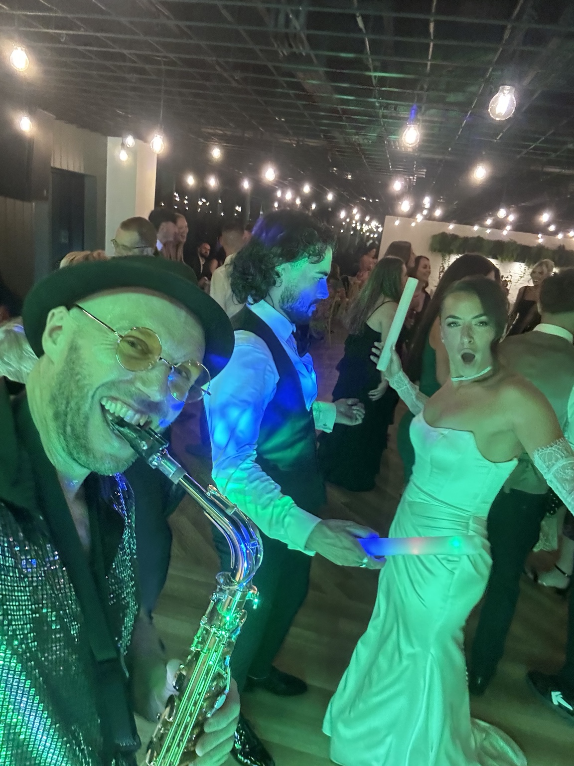 Spencer with Charlotte and wedding guests on the dance floor